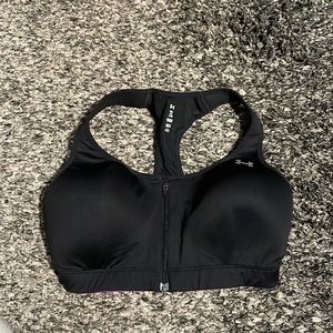 Under Armour heatgear black and purple supported sport bra with zipper